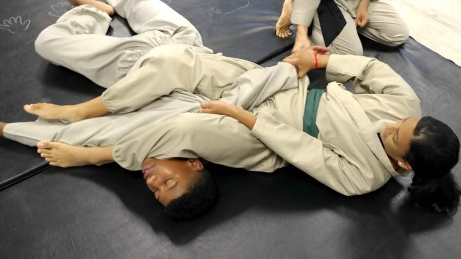 Teens practicing the arm bar. Ballito Martial arts.